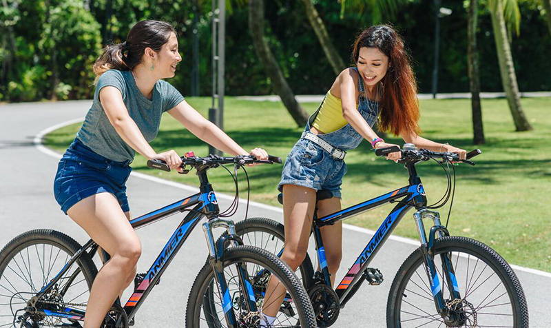 Two ladies enjoying their cycling at Sentosa Singapore